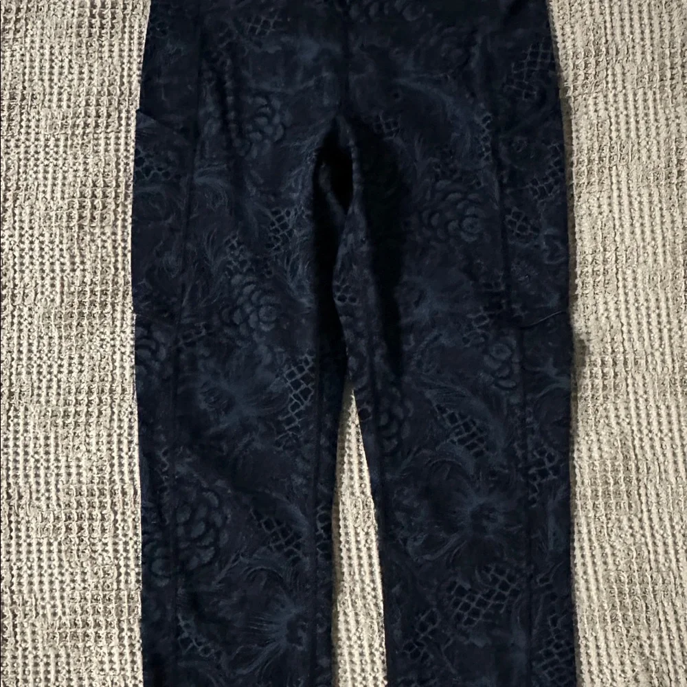 Lululemon black high-waisted leggings with floral pattern
